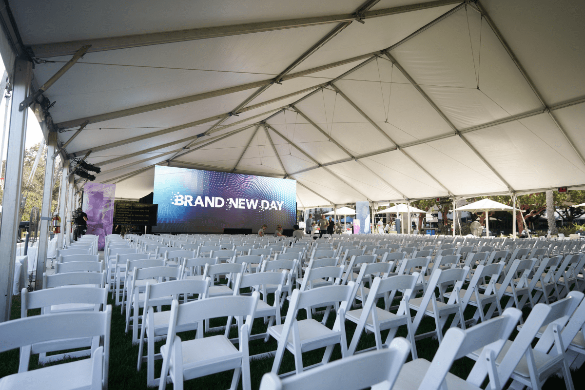 Empty while folding chairs fill the presentation tent at Intuit's Brand New Day All Hand's Meeting in San Diego, California.